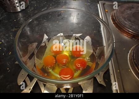 Six cracked eggs Stock Photo