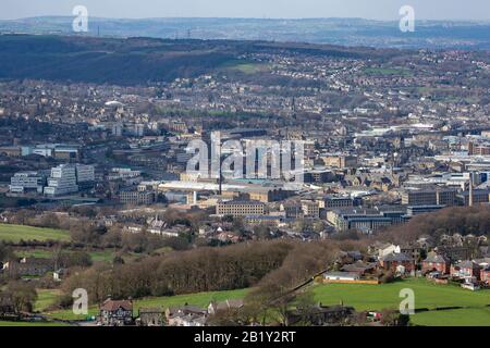An aerial view of Huddersfield a large market town in West Yorkshire at the foot of the Pennine mountain range where the River Colne and Holme meet. Stock Photo