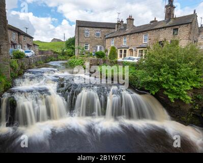 Waterfall on Gayle Beck in the centre of the Yorkshire dales town of Hawes, Wensleydale Stock Photo