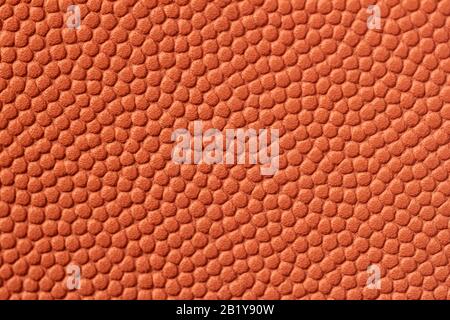 Genuine grainy leather texture closeup, orange color, matte surface, trendy background. Concept of shopping, manufacturing Stock Photo