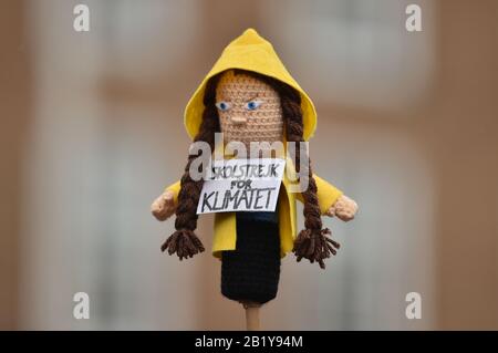 A knitted doll made to look like Greta Thunberg as environmental activists gather ahead of the Bristol Youth Strike 4 Climate protest at College Green in Bristol. Stock Photo