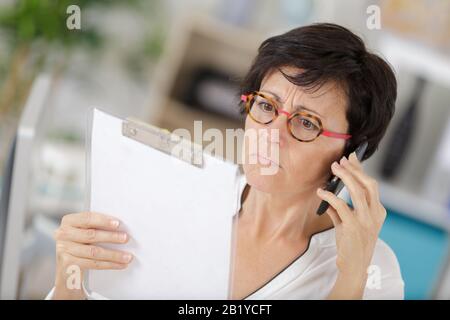 a supervisor with a smartphone Stock Photo