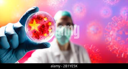 Corona Virus Scientist With Protective Mask And Gloves Holding Cell Colture Petri Dish Stock Photo