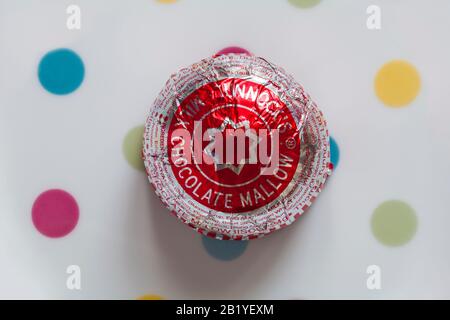 Tunnocks teacake on spotted plate - plate with coloured dots spots Stock Photo