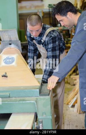 working together in workshop with precision tools Stock Photo