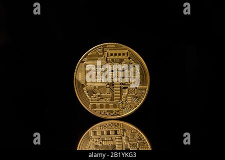 back of bitcoin isolated on  black background.  . Physical bit coin. Digital currency. Cryptocurrency Stock Photo