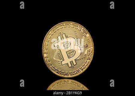Bitcoin isolated on black background. Crypto currency bitcoin golden symbol Stock Photo