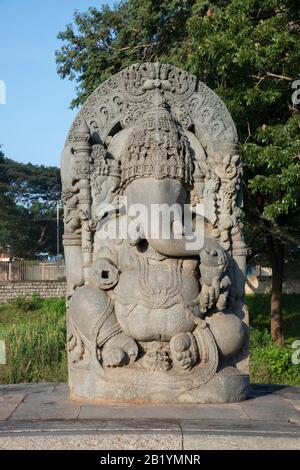 Carved idol of Lord Ganesha, western entrance  Hoysaleswara Shiva temple, Halebidu, Karnataka, India Stock Photo