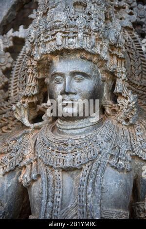 Closeup of Dwarapalaka face at Mandapam entrance of main temple Hoysaleswara Shiva temple, Halebidu, Karnataka, India Stock Photo