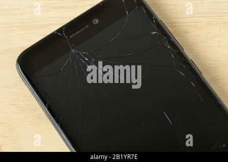 Close-up of mobile phone with cracked screen Stock Photo