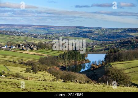 Scenic sunny Lower Laithe Reservoir (upland villages, cottages, valley slopes, hilly farmland fields, moors) - Haworth Moor, West Yorkshire England UK Stock Photo