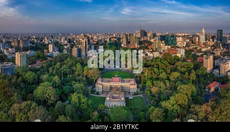 Aerial panoramic cityscape view of Independence Palace or Reunification Palace and center Ho Chi Minh City, Vietnam with blue sky at sunset. Stock Photo