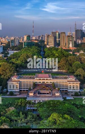 Aerial panoramic cityscape view of Independence Palace or Reunification Palace and center Ho Chi Minh City, Vietnam with blue sky at sunset. Stock Photo