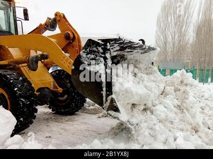 Big machine cleaning the snow from the road Stock Photo