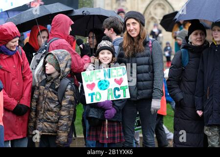 Bristol, UK - Friday 28th February 2020 - Young student protesters and families gather on College Green in the rain to support the Bristol Youth Strike 4 Climate. Credit: Steven May/Alamy Live News Stock Photo