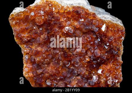 Macro closeup of citrine quartz mineral from Brazil isolated on a pure black background Stock Photo
