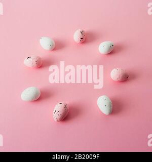 Pink and white easter eggs, quail, circle frame. Stock Photo