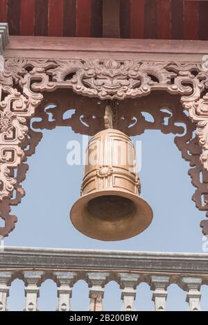 Typical bell tower outdoor instrument, ancient bell and gazebo in the pagoda in Vietnam Stock Photo