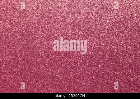 Tinsel texture, shiny grainy background, pink sparkles. Material pattern, fabric of metallic color, decoration. Gradient on textile, clothes. Glitter Stock Photo