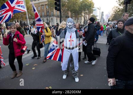 Pro Brexit anti European Union Leave protesters demonstrating in Westminster on what, prior to another Brexit Day extension, would have been the day the UK was scheduled to leave the EU, and instead political parties commence campaigning for a General Election on 31st October 2019 in London, England, United Kingdom. Brexit is the scheduled withdrawal of the United Kingdom from the European Union. Following a June 2016 referendum, in which 51.9% of participating voters voted to leave. Stock Photo