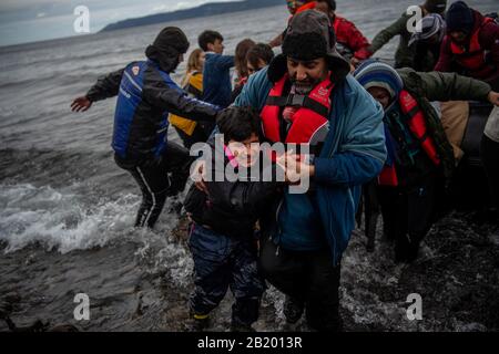 Lesbos, Greece. 28th Feb, 2020. A boat with 54 Afghan refugees, including 24 children, arrives on the Greek island of Lesbos. According to the state news agency Anadolu, a spokesman for the Turkish ruling party AKP has hardly concealed his threat to open the borders for refugees in the country. Credit: Angelos Tzortzinis/dpa/Alamy Live News Stock Photo