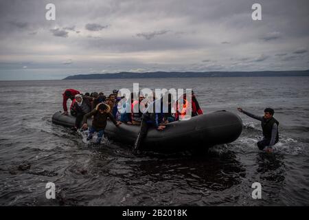 Lesbos, Greece. 28th Feb, 2020. A boat with 54 Afghan refugees, including 24 children, arrives on the Greek island of Lesbos. According to the state news agency Anadolu, a spokesman for the Turkish ruling party AKP has hardly concealed his threat to open the borders for refugees in the country. Credit: Angelos Tzortzinis/dpa/Alamy Live News Stock Photo