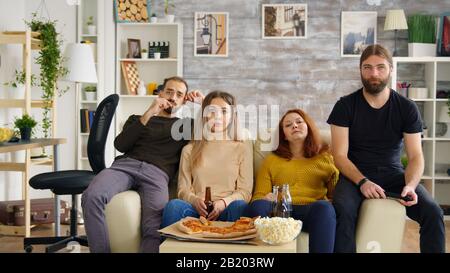 Man beating woman at video games with controller on console over blue  background. Boyfriend celebrating win and girlfriend feeling disappointed  about losing online gameplay in studio Stock Photo - Alamy