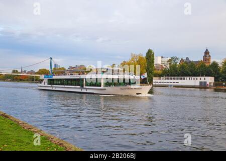 Frankfurt, Germany - October 2019 : A boat on the river Main in the background the skyline of Frankfurt on Main, in Germany. Stock Photo