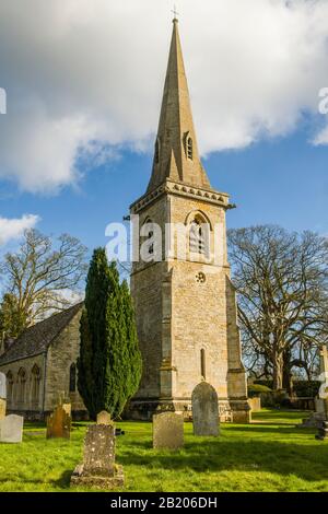 The parish church of St Mary in the Cotswolds village of Lower Slaughter near Burton on the Water in Gloucestershire on a sunny afternoon in February
