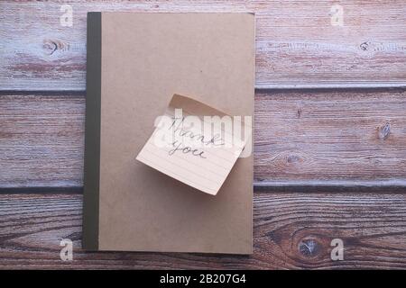 thank you note on notepad on table  Stock Photo