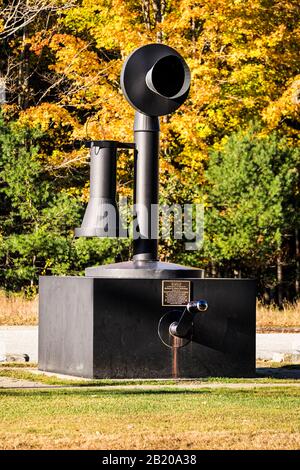 World's Largest Telephone. An old-fashioned candlestick phone, 14 feet tall. Bryant Pond the last US town to give up hand cranked telephones Stock Photo