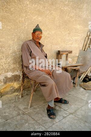 Travel Photography - Egyptian man in the City of the Dead in Cairo in Egypt in North Africa Middle East Stock Photo