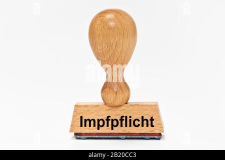 a stamp with the inscription Impfpflicht (Compulsory vaccination) Stock Photo