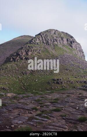 A view from the top of the Quinag mountain range, Scotland with mountain tops and sky Stock Photo