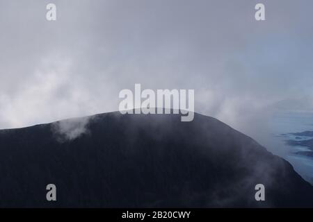 A view from the top of the Quinag mountain range, Scotland with mountain tops and sky Stock Photo