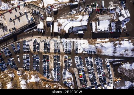 Top down view of the parking at the entrance of the car free Saas Fee village in the alps in Switzerland Stock Photo