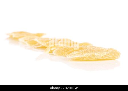 Lot of slices of dried yellow pineapple isolated on white background Stock Photo