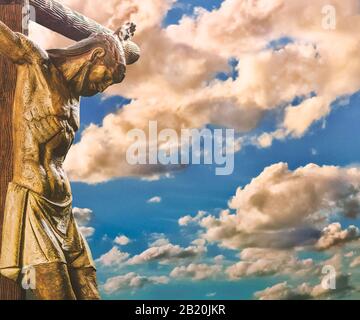 Chrisitanity religious concept artwork depicting jesus on the cross over cloudy sky background Stock Photo