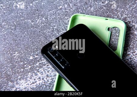 Mobile phone with four cameras. Modern device. Stock Photo