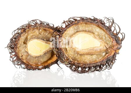 Group of two halves of old brown rambutan isolated on white background Stock Photo