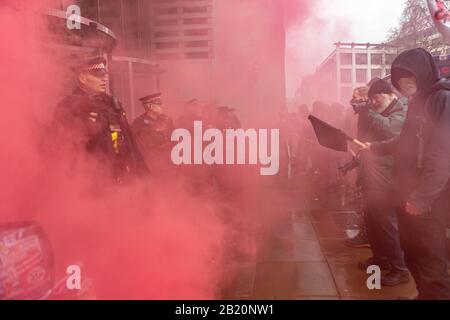 London, UK. 28th Feb, 2020. Various anarchist and anti capitalist groups rally at the Bank of England before moving on to blockade the Stock Exchange in Paternoster Sq. The groups are against what they see as wilful destruction of Earth's ecosystems and the capitalist system supporting this process. Penelope Barritt/Alamy Live News Stock Photo