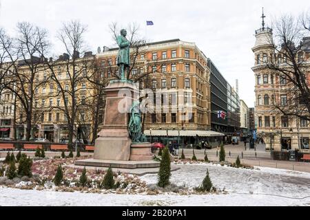 Helsinki, Finland. Monument to Finland-Swedish lyric and epic poet Johan Ludvig Runeberg in a cold winter day, covered in ice and snow Stock Photo