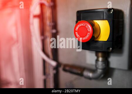 The red emergency button or stop button for Hand press. STOP Button for industrial machine, Emergency Stop. Stock Photo