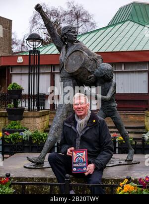 Tranent, East Lothian, Scotland, United Kingdom, 28th February 2020. Kenny MacAskill, recently elected SNP Member of Parliament for East Lothian, publishes a new book on February 27th 2020 (Biteback Publishing) called 'Radical Scotland'. One chapter describes the Tranent Massacre in 1797 in which Jackie Crookston, featured in the sculpture by David Annand behind him, was killed Stock Photo