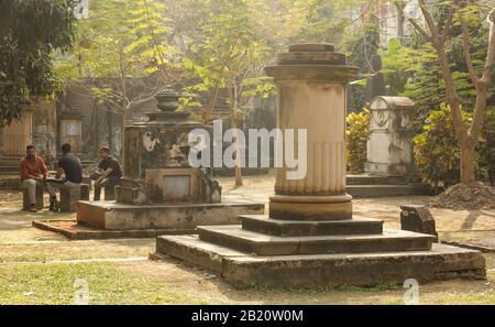 Kolkata, West Bengal/India - January 26 2018: People hang around the gothic, Indo-Saracenic tombs of the South Park Street Cemetery. Stock Photo