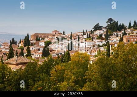 an aerial photo of the old quarter in Granada, Spain with the Sierrra Nevada in the distant background Stock Photo