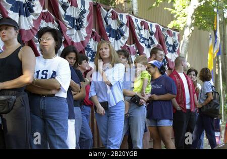 September 14, 2001, Austin, Texas: Customers wait in a long line at a small business in south Austin that specializes in flag sales. Stores were swamped with customers looking for symbols of patriotism following the terrorist attacks on the World Trade Center and Pentagon on Sept. 11. ©Bob Daemmrich Stock Photo