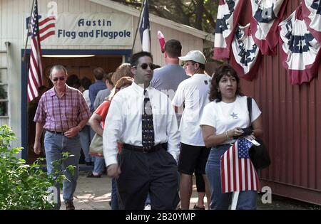 September 14, 2001, Austin, Texas: Business is brisk at a small business in south Austin that specializes in flag sales. Stores were swamped with customers looking for symbols of patriotism following the terrorist attacks on the World Trade Center and Pentagon on Sept. 11. ©Bob Daemmrich Stock Photo
