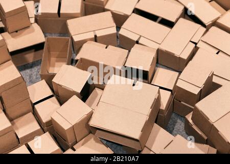 untidy cardboard boxes thrown on the floor to be recycled Stock Photo