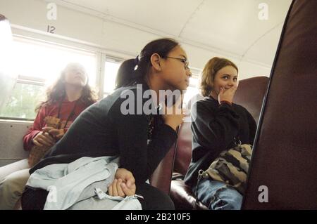 Austin, Texas: Sixth-grade girls riding on school bus to a field trip. 2005  ©Bob Daemmrich Stock Photo
